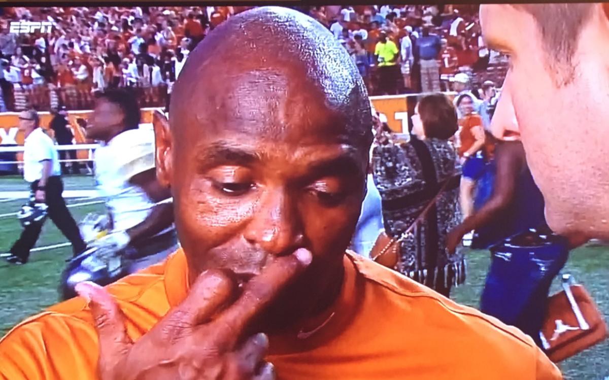 Charlie strong giving a post game interview.