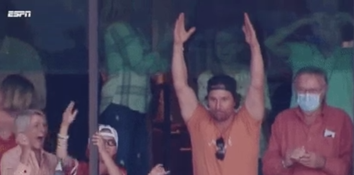 Matthew McConaughey raising his hands in celebration after Texas beat Baylor