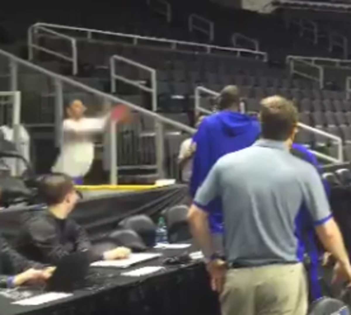 Jeff Capel hits a "Steph Curry" tunnel shot during Duke's practice.