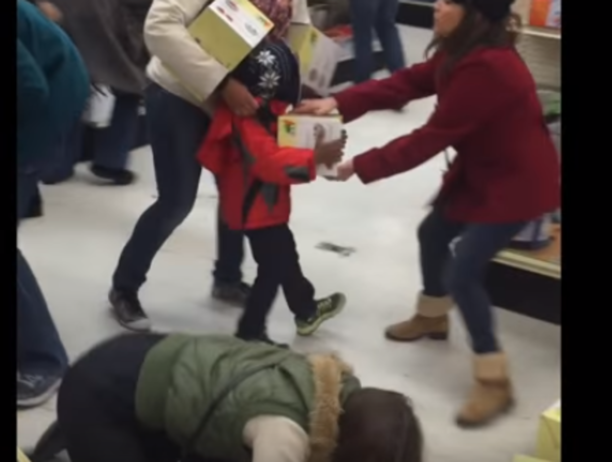 A woman steals from a kid on Black Friday.