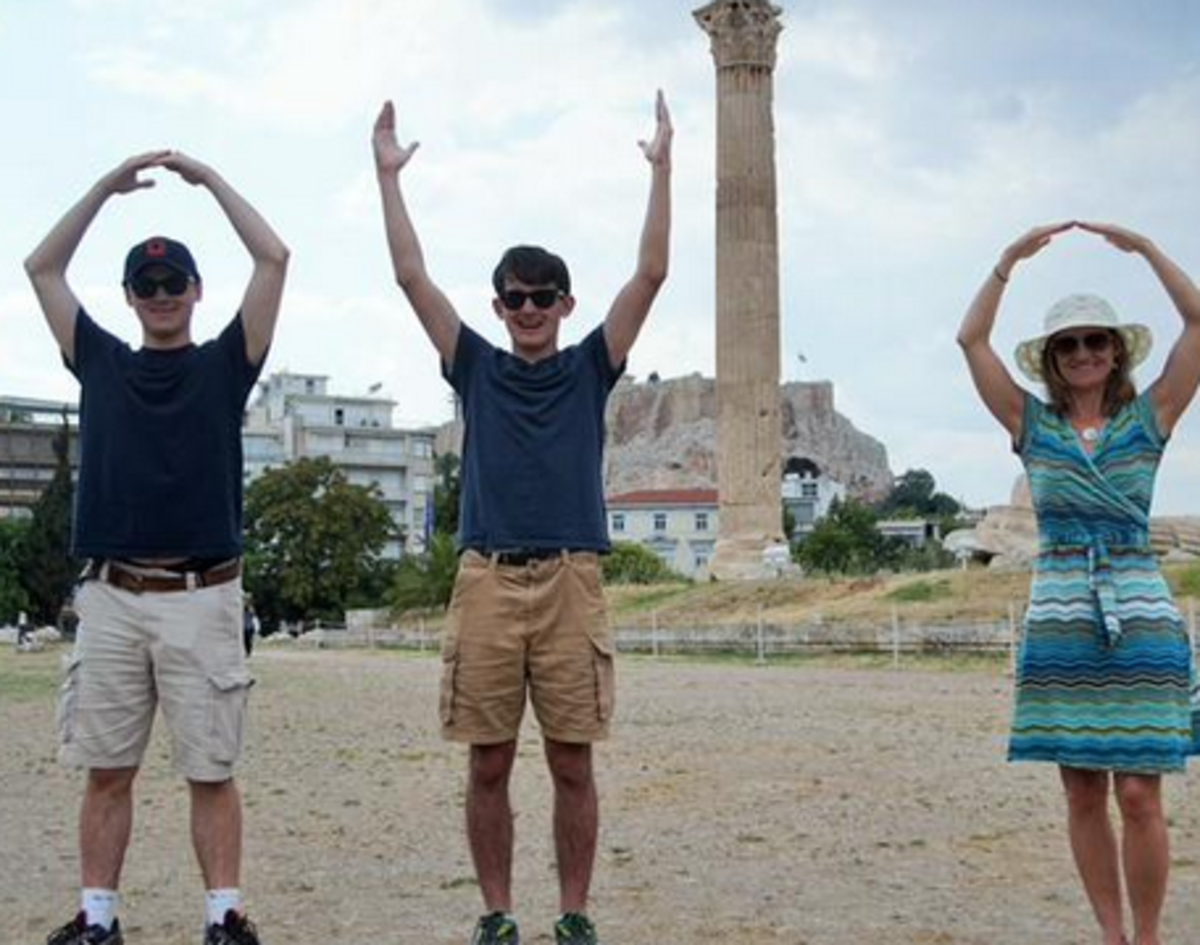 family spells out O-H-I-O with arms and the Olympian Temple of Zeus.