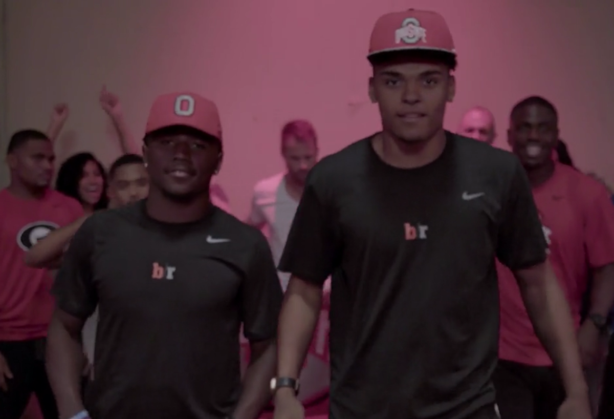 Two recruits wearing Ohio State hats.