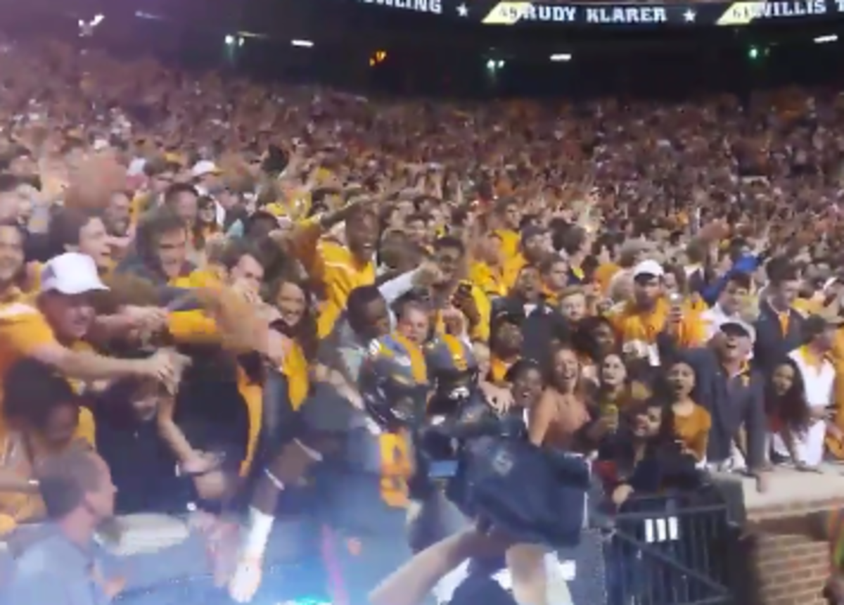 Tennessee players seen sitting with the fans after big win over Georgia.