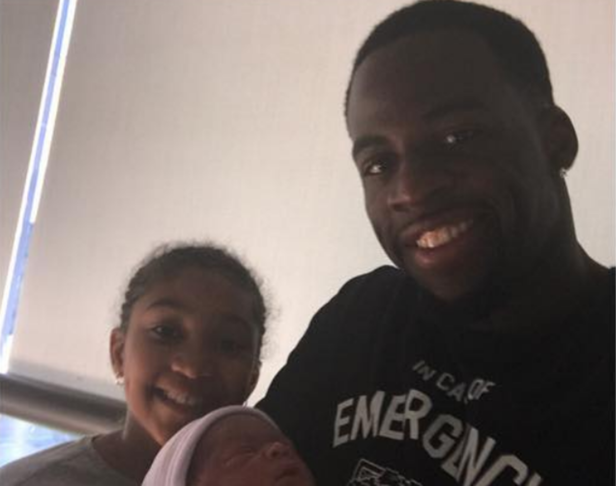 Draymond Green poses in a photo of his newborn.