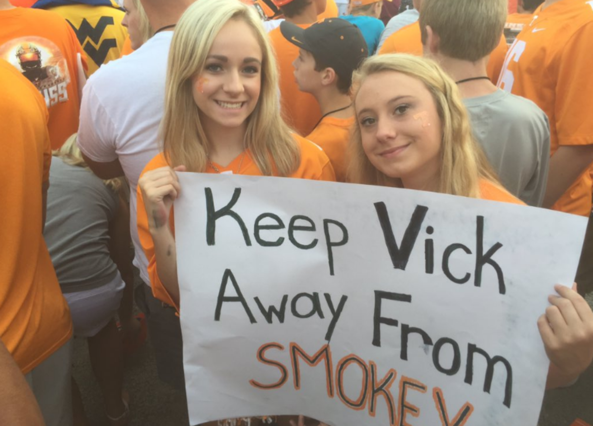 Tennessee fans holding up a sign.