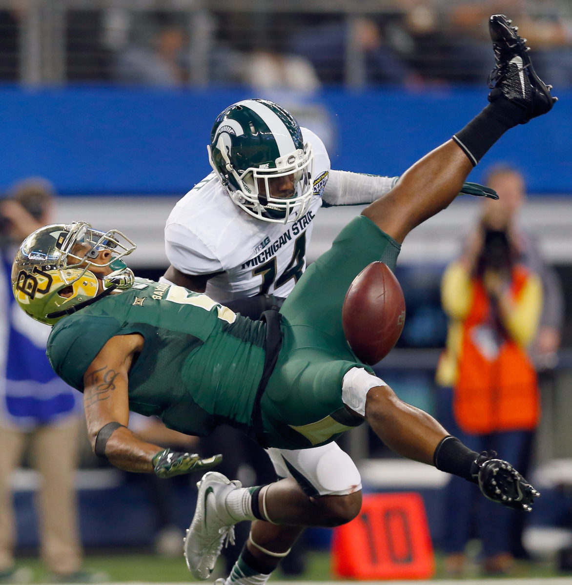 michigan state and baylor players collide during the cotton bowl