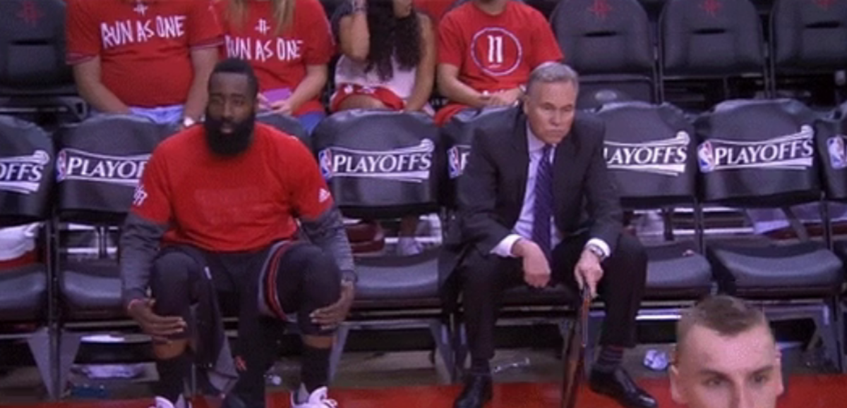A photo of Mike D'Antoni and James Harden sitting on a bench.