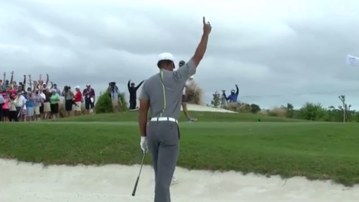 Tiger Woods celebrates a great chip.
