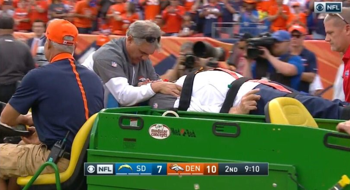 Wade Phillips being carted off the field.