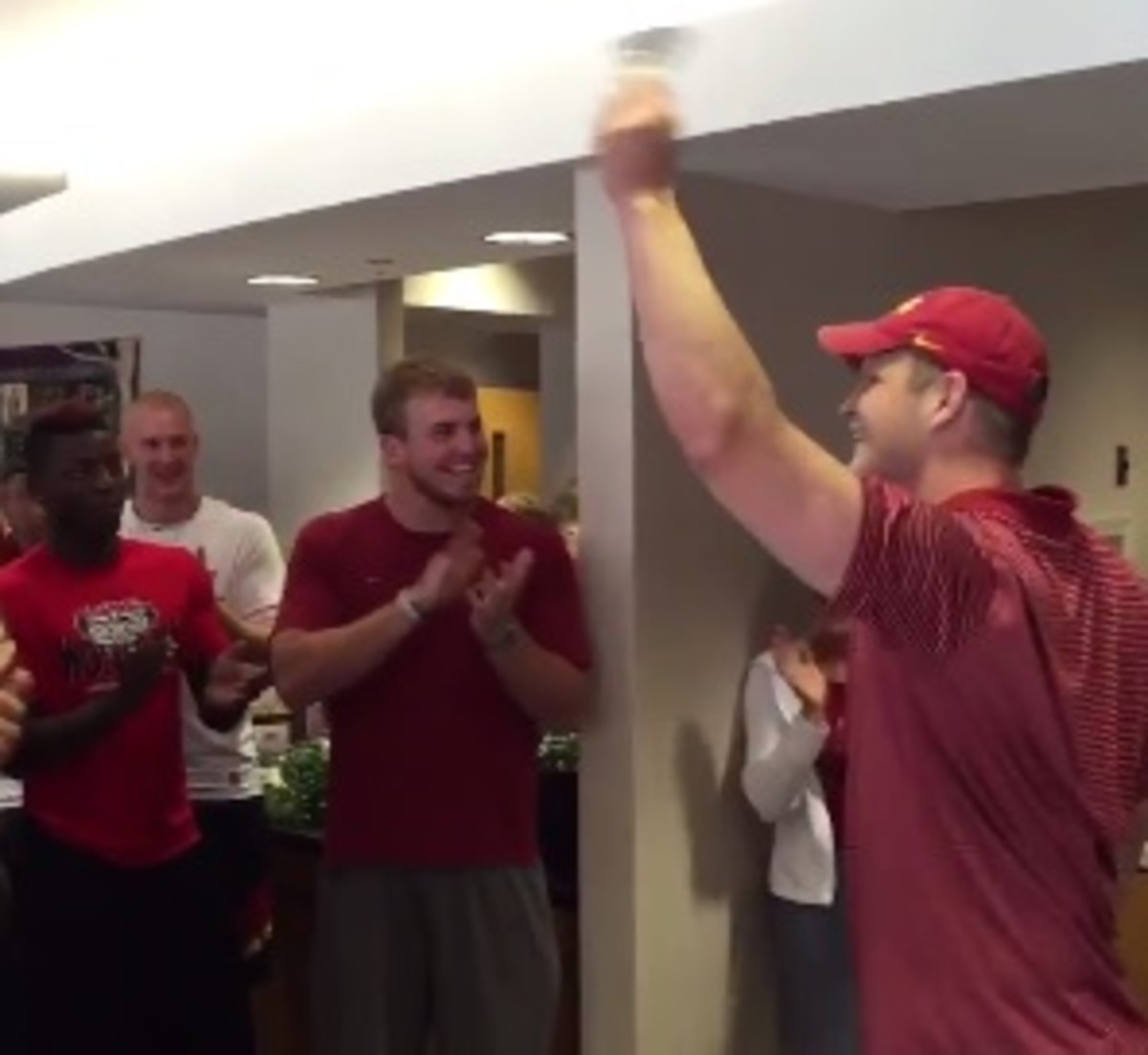 Iowa State football players surprise teammate Mitchell Meyers after final chemo session.