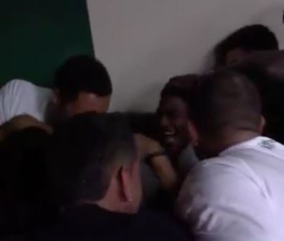 Teammates mob Antwan Scott after he is granted sixth year of eligibility.