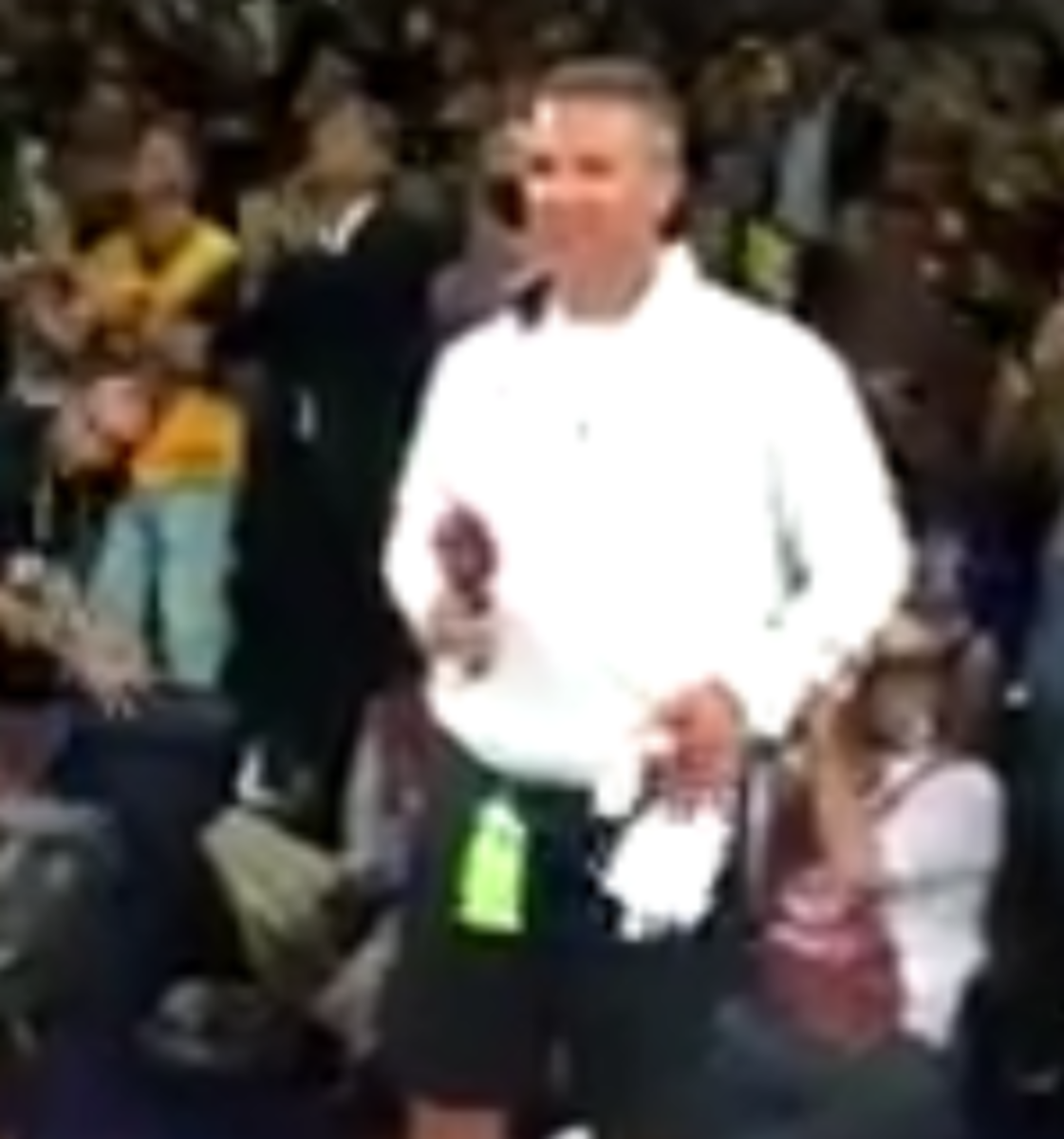 Urban Meyer leads an O-H-I-O chant at the cavs game.