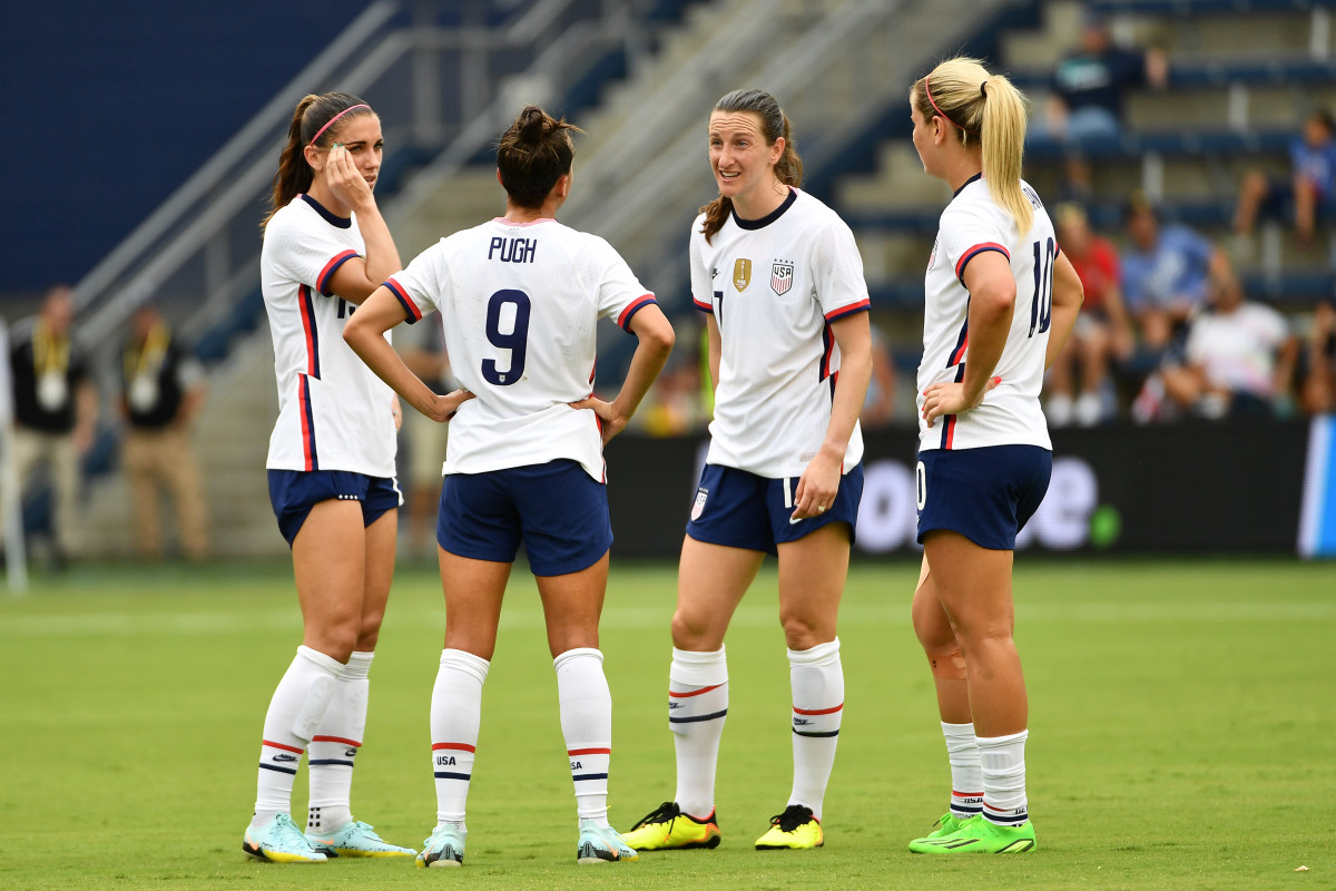 U.S. Soccer star Mallory Pugh on the field with Alex Morgan and teammates.