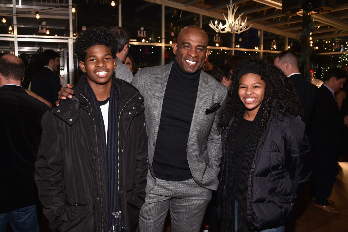 NEW YORK, NY - DECEMBER 14:  (L-R) Shedeur Sanders, former football player Deion Sanders and Shelomi Sanders attend On Location Experiences' 51 Days To Super Bowl LI Celebration at STK Rooftop on December 14, 2016 in New York City.  (Photo by Bryan Bedder/Getty Images for On Location Experiences)