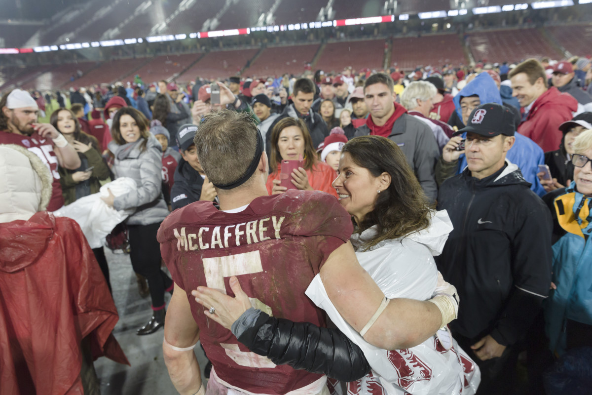 Christian McCaffrey hugs his mom Lisa following a Stanford football game.