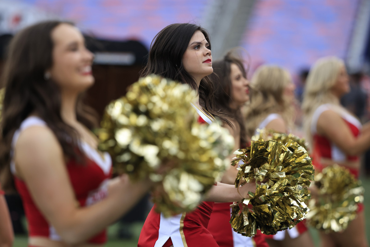 An Arizona Cardinals cheerleader performs at the two minute