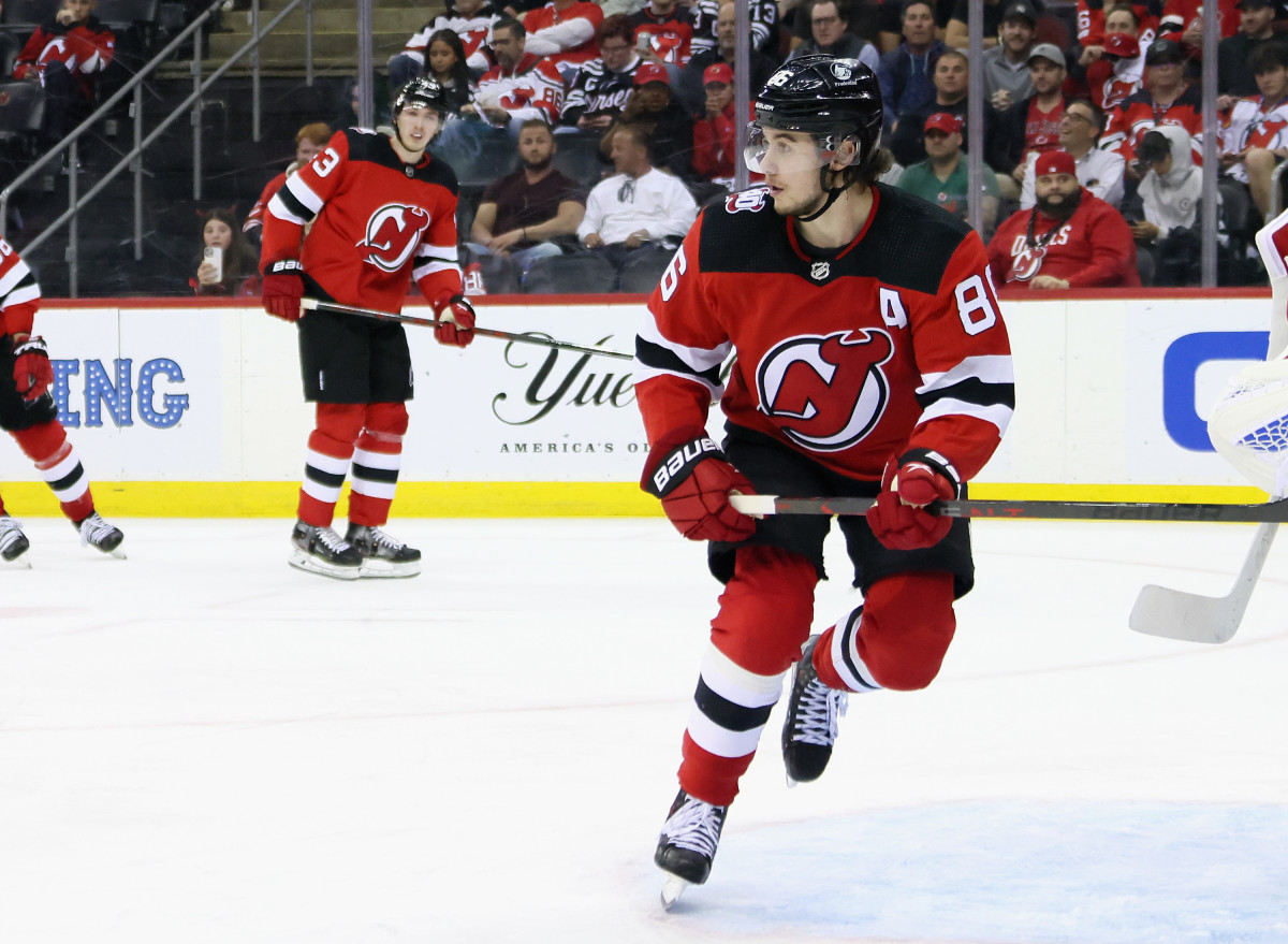 New Jersey Devils center Jack Hughes skates the ice during the