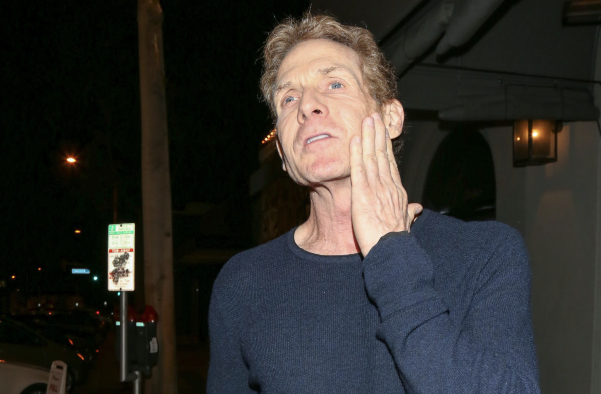 Skip Bayless outside a restaurant.