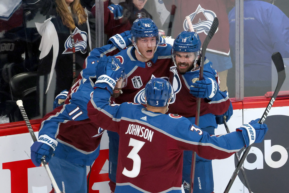 DENVER, COLORADO - JUNE 18: Josh Manson #42 of the Colorado Avalanche celebrates with Andrew Cogliano #11, Jack Johnson #3 and Alex Newhook #18 of the Colorado Avalanche after scoring a goal during the first period in Game Two of the 2022 NHL Stanley Cup Final against the Tampa Bay Lightning at Ball Arena on June 18, 2022 in Denver, Colorado. (Photo by Bruce Bennett/Getty Images)