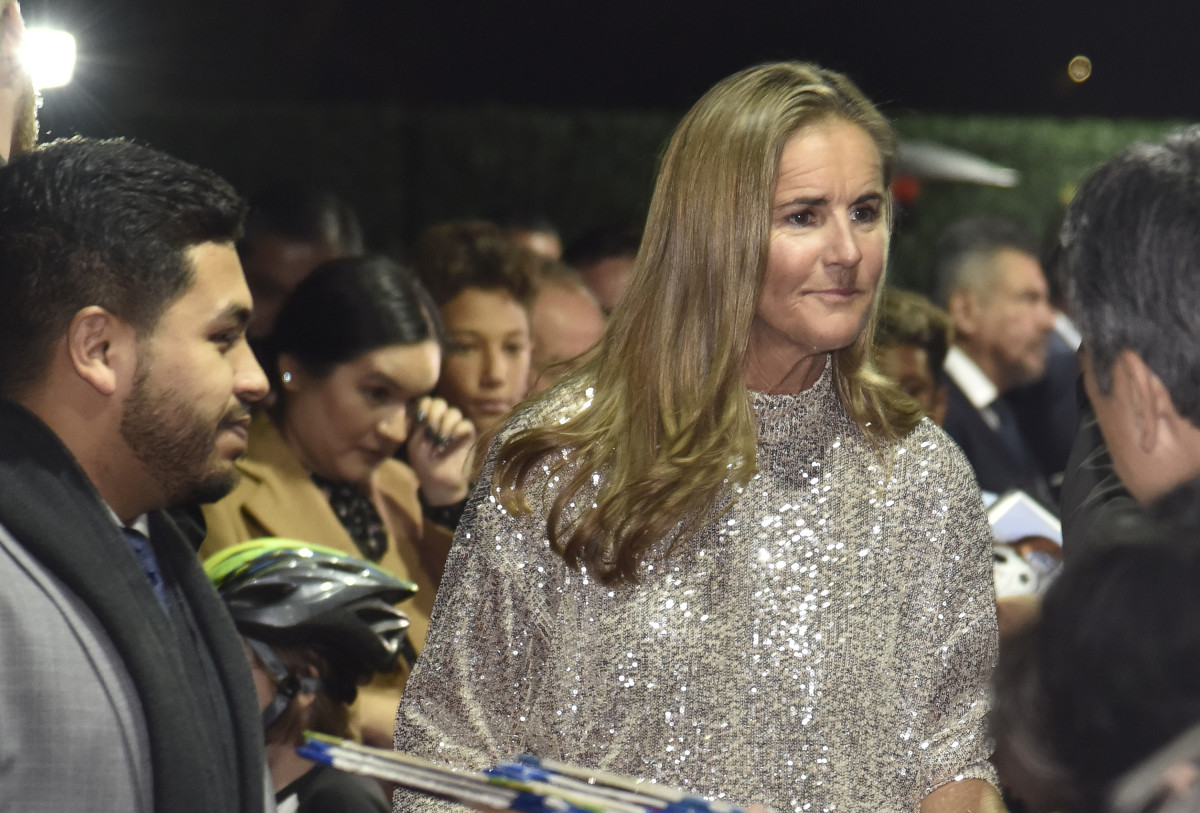 Soccer legend Brandi Chastain speaks with the media at a function.