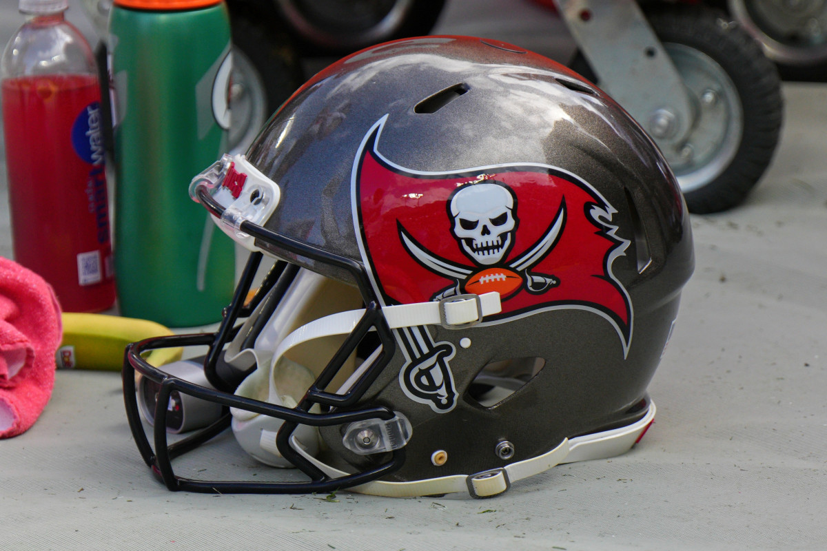 TAMPA, FL - JANUARY 16: Tampa Bay Buccaneers helmet sits on the field during the game between the Philadelphia Eagles and the Tampa Bay Buccaneers on January 16, 2022 at  Raymond James Stadium in Tampa, FL. (Photo by Andy Lewis/Icon Sportswire via Getty Images)