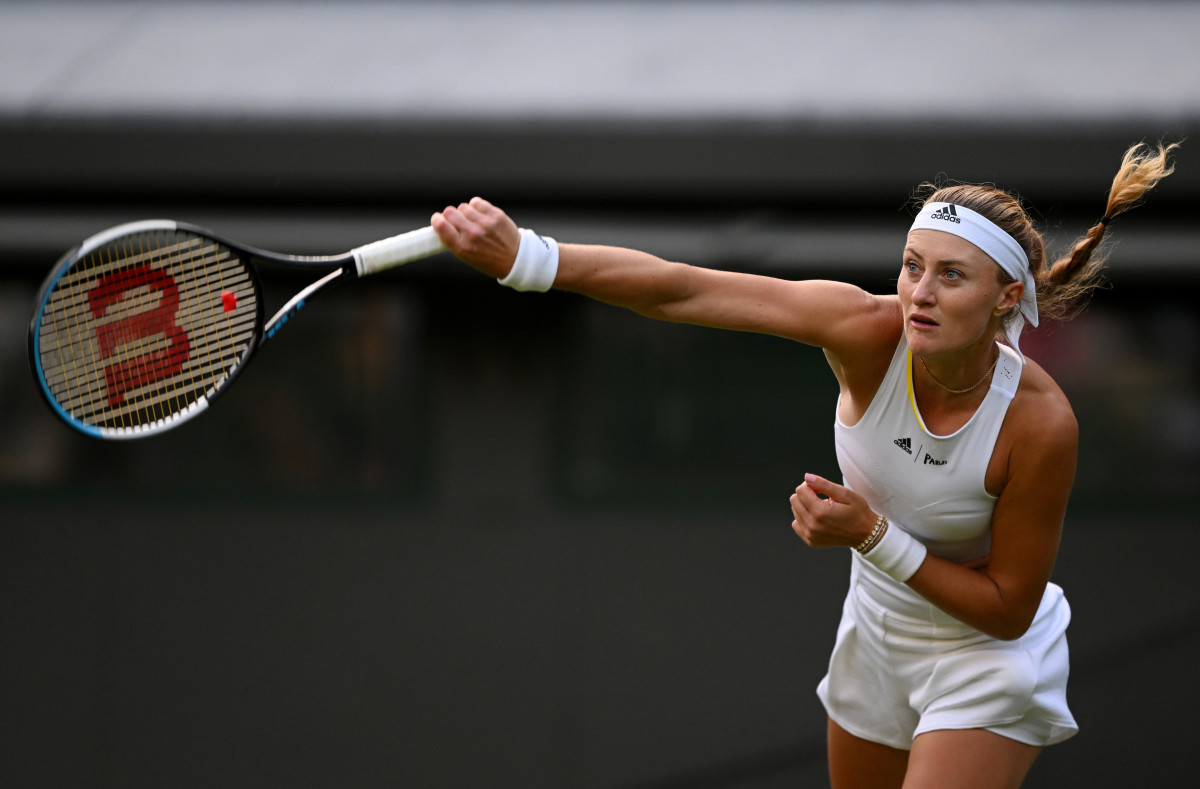 Kristina Mladenovic of France serves in the first round of Wimbledon 2022.