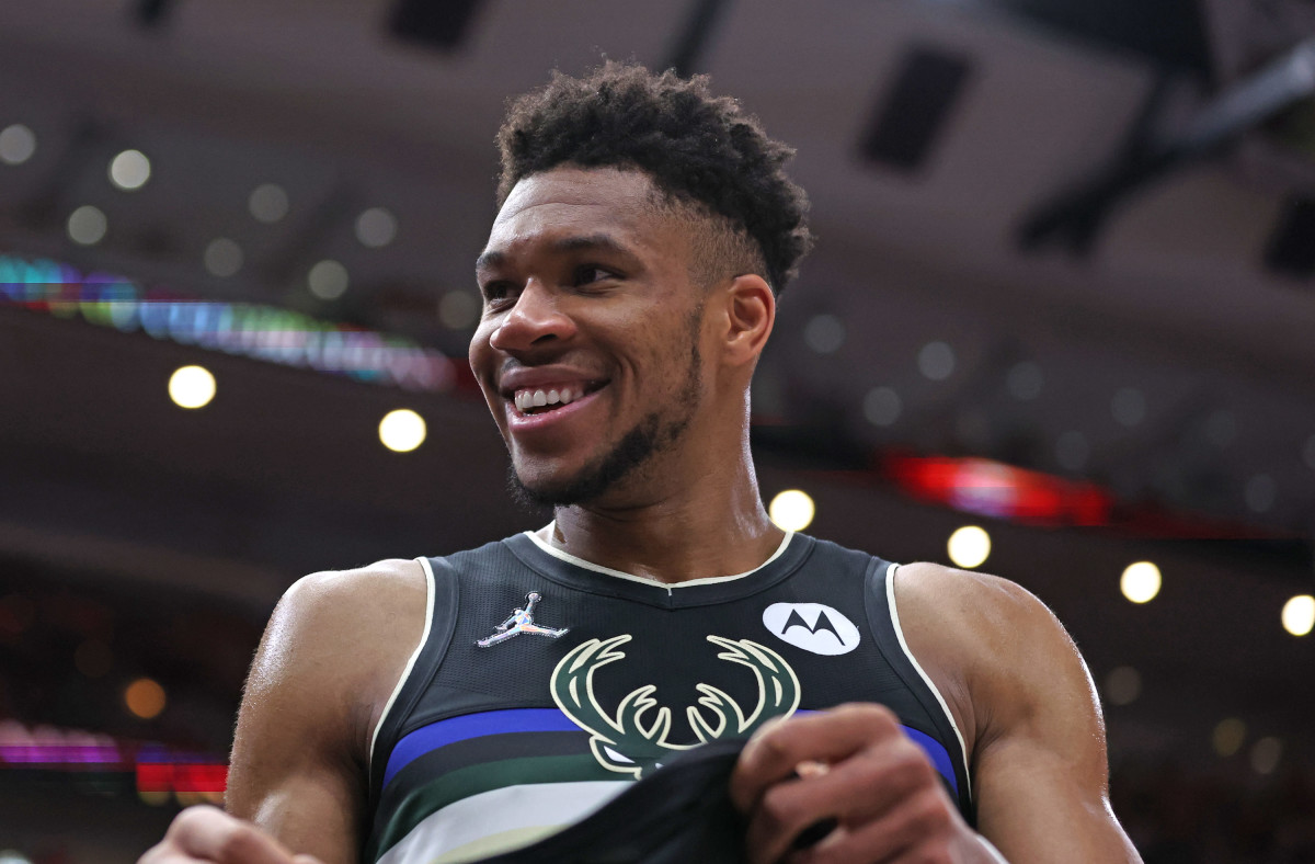 CHICAGO, ILLINOIS - APRIL 24: Giannis Antetokounmpo #34 of the Milwaukee Bucks smiles at fans near the end of Game Four of the Eastern Conference First Round Playoffs against the Chicago Bulls at the United Center on April 24, 2022 in Chicago, Illinois. The Bucks defeated the Bulls 119-95. NOTE TO USER: User expressly acknowledges and agrees that, by downloading and or using this photograph, User is consenting to the terms and conditions of the Getty Images License Agreement. (Photo by Jonathan Daniel/Getty Images)