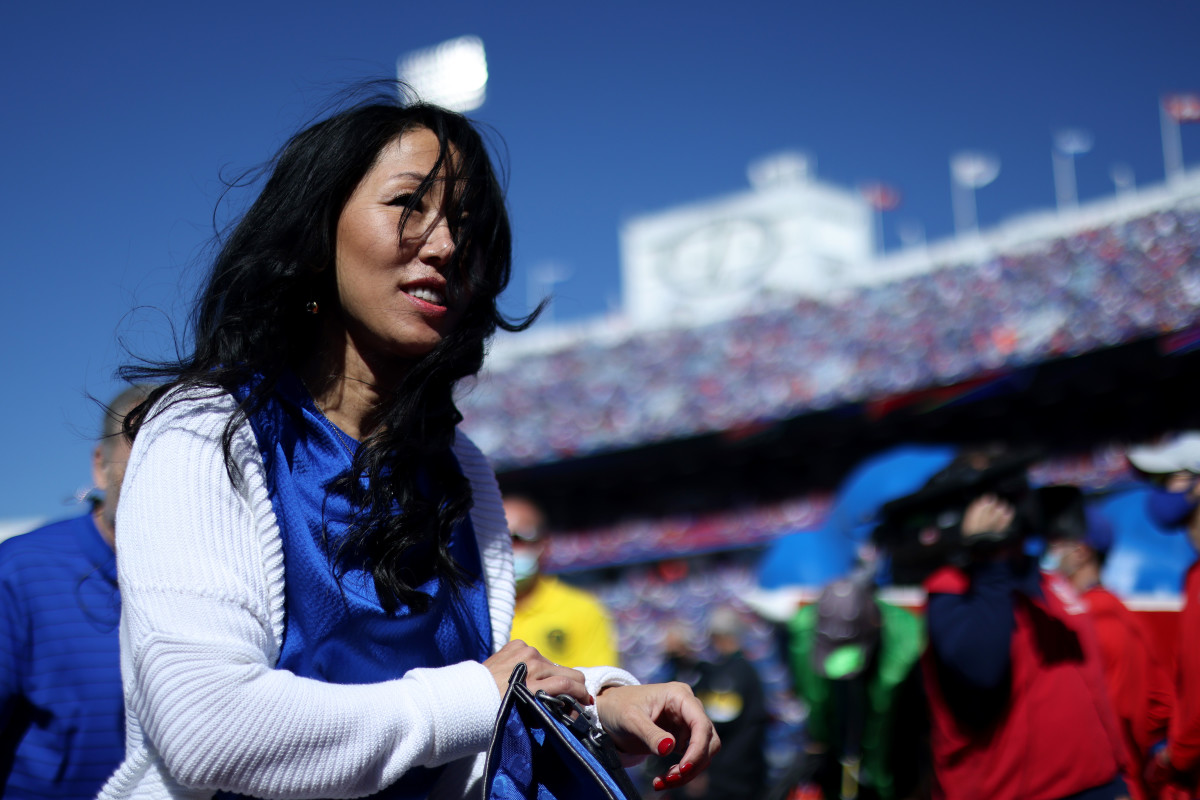 Bills owner Kim Pegula on the field during a game.