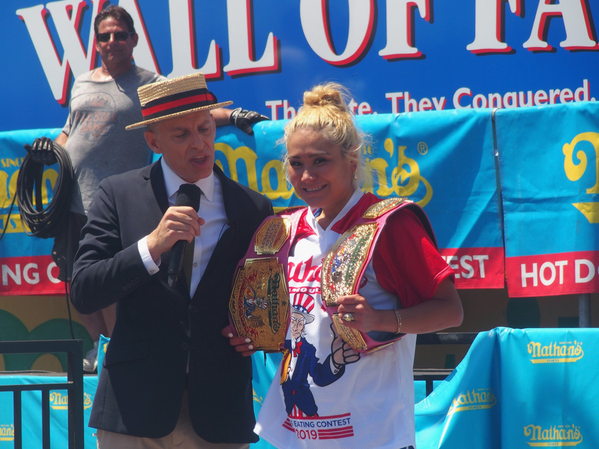 NEW YORK, NY - JULY 04:  Miki Sudo wins in the women's competition with 31 hot dogs at the 2019 Nathans Famous Fourth of July International Hot Dog Eating Contest at Coney Island on July 4, 2019 in the Brooklyn borough of New York City.  (Photo by Bobby Bank/Getty Images)