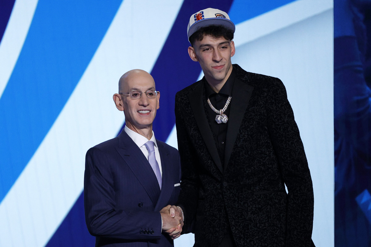 NEW YORK, NEW YORK - JUNE 23: NBA commissioner Adam Silver (L) and Chet Holmgren pose for photos after Holmgren was drafted with the 2nd overall pick by the Oklahoma City Thunder during the 2022 NBA Draft at Barclays Center on June 23, 2022 in New York City. NOTE TO USER: User expressly acknowledges and agrees that, by downloading and or using this photograph, User is consenting to the terms and conditions of the Getty Images License Agreement. (Photo by Sarah Stier/Getty Images)