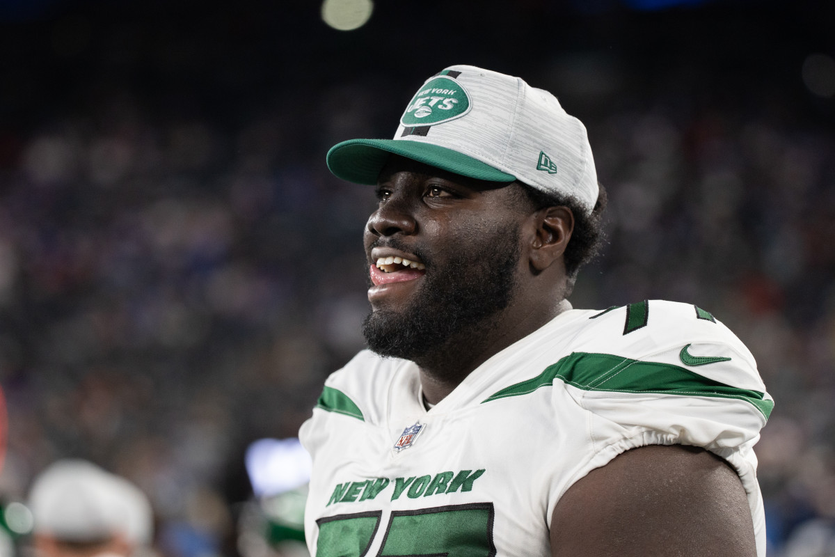 EAST RUTHERFORD, NJ - AUGUST 14: Mekhi Becton #77 of the New York Jets on the sideline during the fourth quarter of a preseason game against the New York Giants at MetLife Stadium on August 14, 2021 in East Rutherford, New Jersey. (Photo by Dustin Satloff/Getty Images)