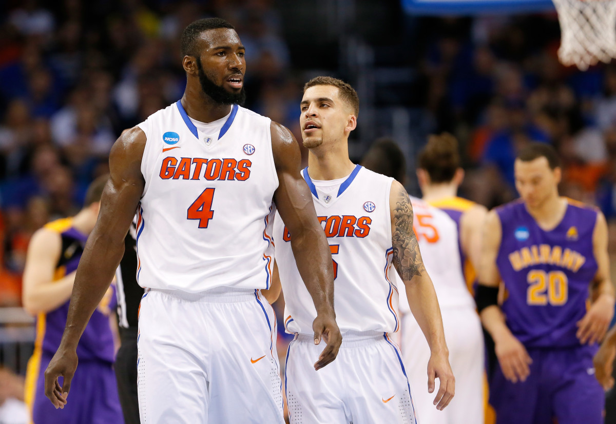 ORLANDO, FL - MARCH 20:  Patric Young #4 reacts with teammate Scottie Wilbekin #5 of the Florida Gators in the second half against the Albany Great Danes during the second round of the 2014 NCAA Men's Basketball Tournament at Amway Center on March 20, 2014 in Orlando, Florida.  (Photo by Kevin C. Cox/Getty Images)