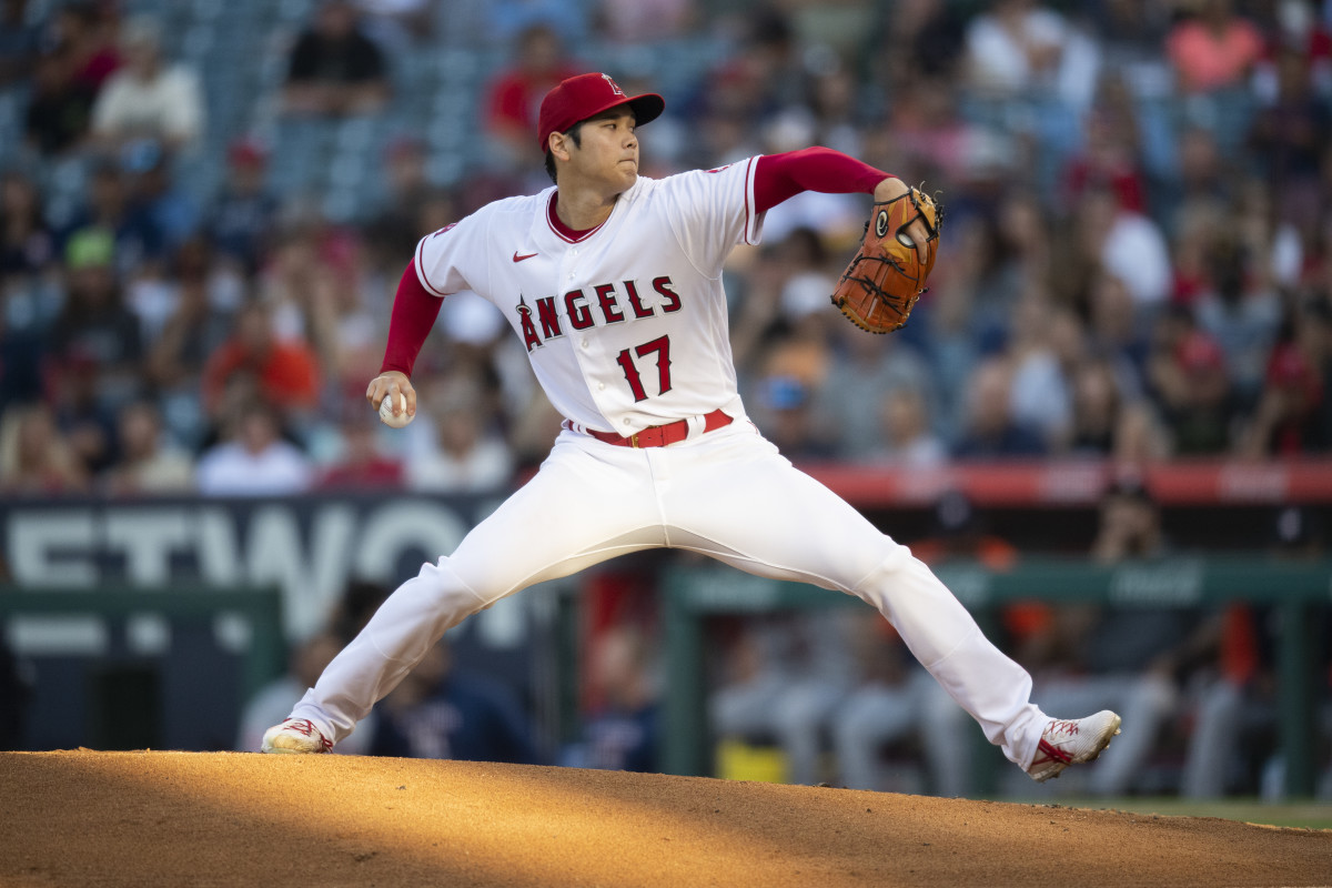 ANAHEIM, CA - JULY 13: Shohei Ohtani #17 of the Los Angeles Angels pitches against the Houston Astros bench after the first inning at Angel Stadium of Anaheim on July 13, 2022 in Anaheim, California. (Photo by John McCoy/Getty Images)