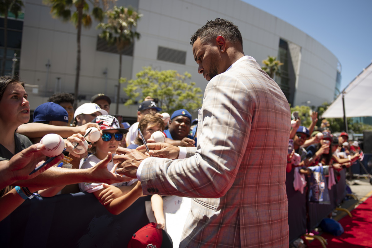 LOS ANGELES, CALIFORNIA - JULY 19: Xander Bogaerts #2 of the Boston Red Sox signs autographs for fans as he walks the red carpet during the 2022 MLB All-Star Game Red Carpet Show on July 19, 2022 at L.A. Live in Los Angeles, California. (Photo by Maddie Malhotra/Boston Red Sox/Getty Images)