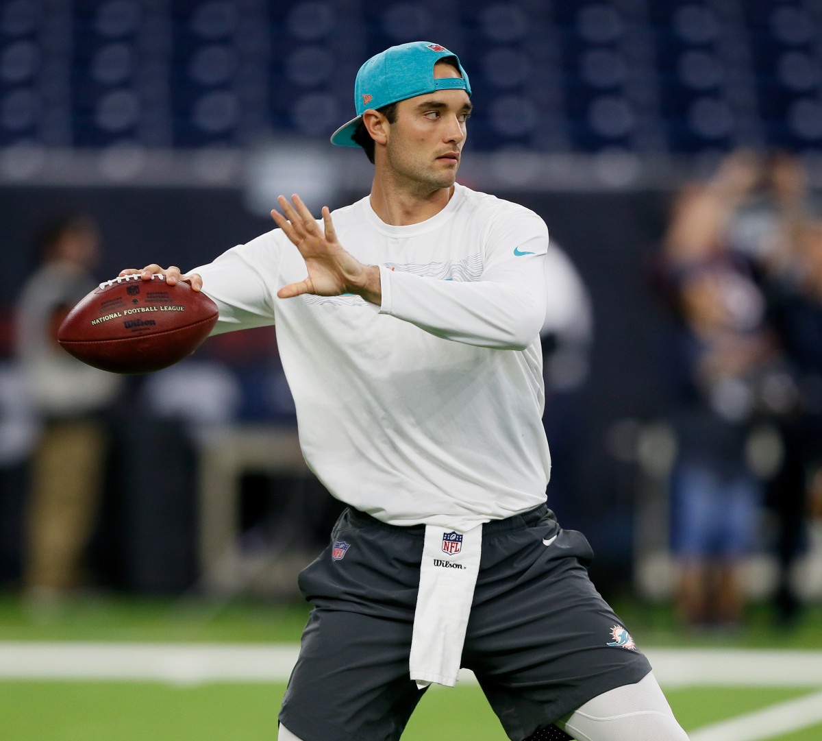 HOUSTON, TX - OCTOBER 25:  Brock Osweiler #8 of the Miami Dolphins warms up before a football game against the Houston Texans at NRG Stadium on October 25, 2018 in Houston, Texas.  (Photo by Bob Levey/Getty Images)