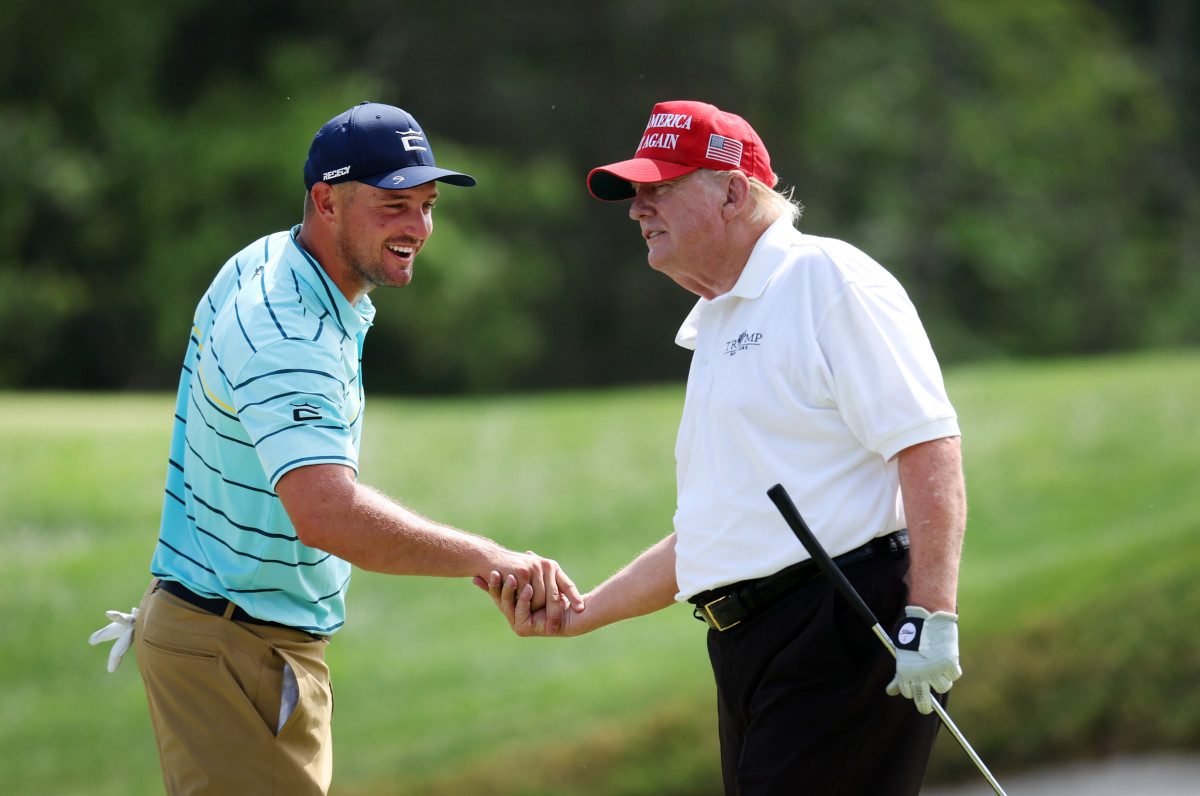 BEDMINSTER, NEW JERSEY - JULY 28: (L-R) Team Captain Bryson DeChambeau of Crushers GC interacts with former U.S. President Donald Trump on the fourth hole during the pro-am prior to the LIV Golf Invitational - Bedminster at Trump National Golf Club Bedminster on July 28, 2022 in Bedminster, New Jersey. (Photo by Jonathan Ferrey/LIV Golf via Getty Images)