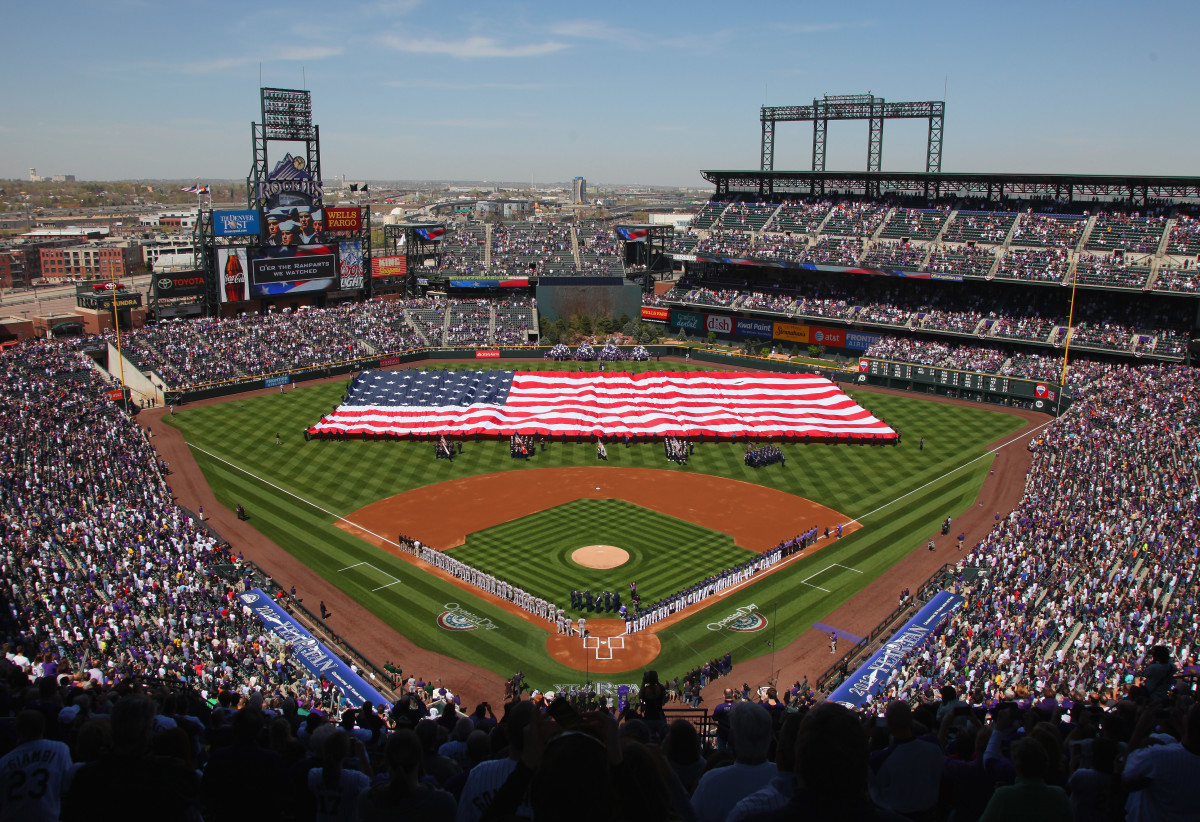 DENVER, CO - APRIL 09:  The American Flag is displayed on the field as the national anthem is observed prior to the game between the San Francisco Giants and the Colorado Rockies on Opening Day at Coors Field on April 9, 2012 in Denver, Colorado.  (Photo by Doug Pensinger/Getty Images)