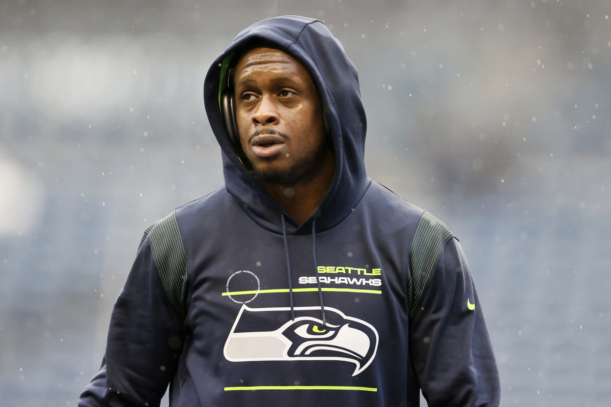 SEATTLE, WASHINGTON - JANUARY 02: Geno Smith #7 of the Seattle Seahawks looks on before the game against the Detroit Lions at Lumen Field on January 02, 2022 in Seattle, Washington. (Photo by Steph Chambers/Getty Images)