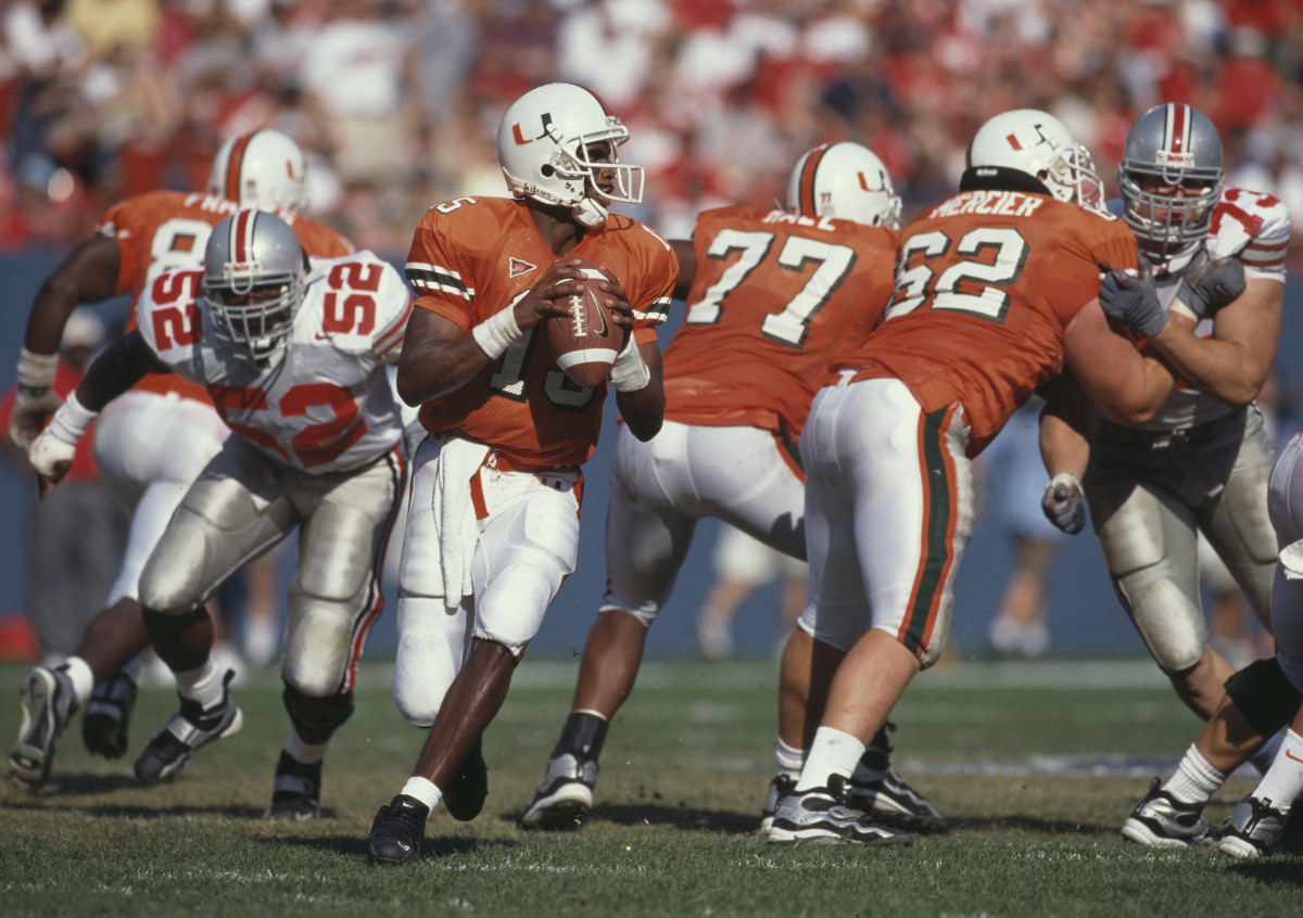 Kenny Kelly #15, Quarterback for the University of Miami Hurricanes in motion during the NCAA Kickoff Classic college football game against the Ohio State Buckeyes on 29th August 1999 at the Giants Stadium in East Rutherford, New Jersey, United States. The Miami Hurricanes won the game 23 - 12. (Photo by Jamie Squire/Getty Images)