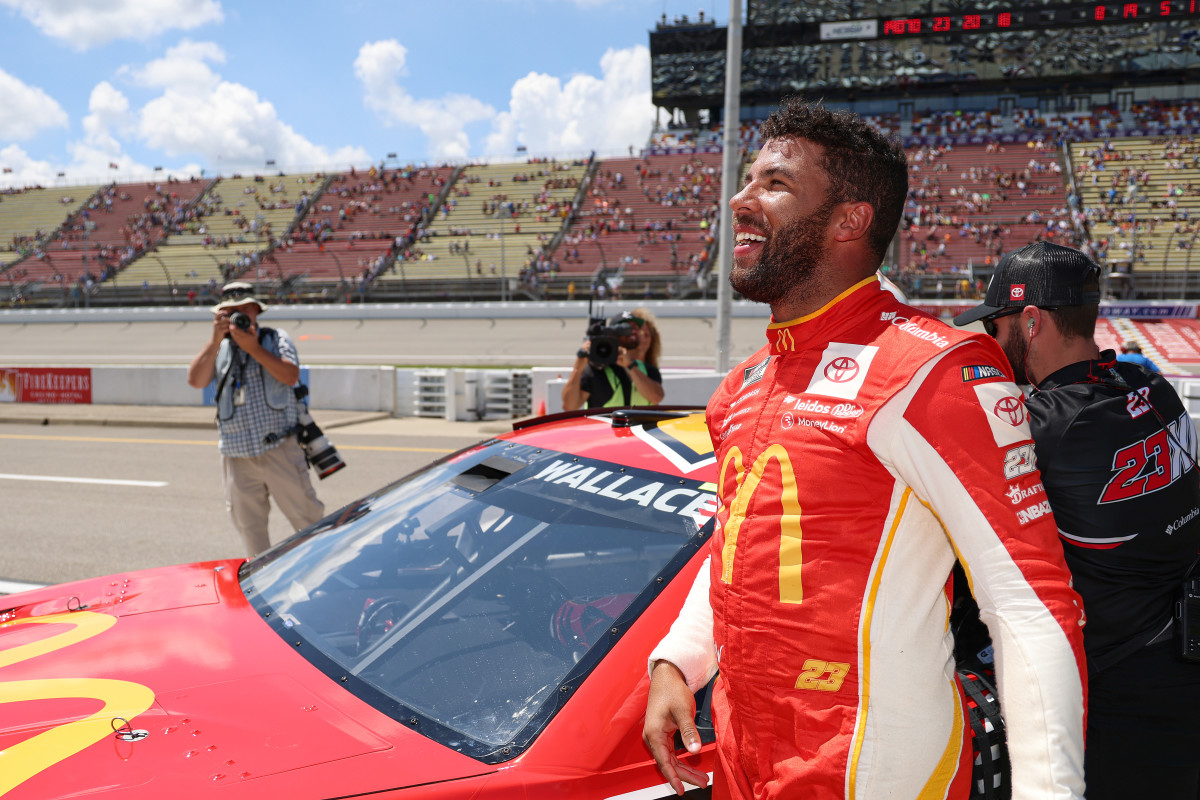 BROOKLYN, MICHIGAN - AUGUST 06: Bubba Wallace, driver of the #23 McDonald's Toyota, celebrates after winning the pole award for the NASCAR Cup Series FireKeepers Casino 400 at Michigan International Speedway on August 06, 2022 in Brooklyn, Michigan. (Photo by Mike Mulholland/Getty Images)