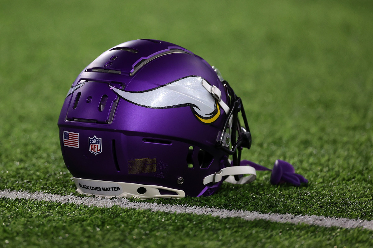 A Minnesota Vikings helmet sits on the field during warmups.