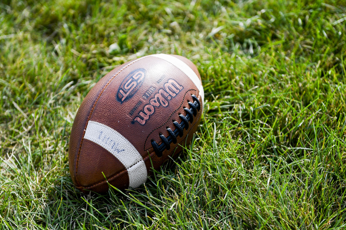 A football on a field.