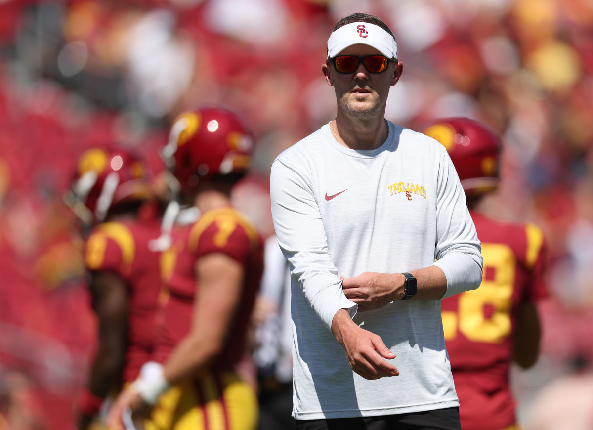 Lincoln Riley on the field for USC's home opener against Rice.