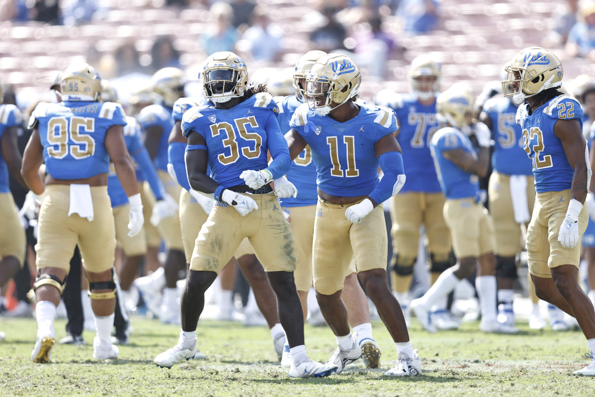 The UCLA Bruins celebrate after sacking Jamie Sheriff of South Alabama after Sheriff faked a field goal attempt late in the fourth quarter.