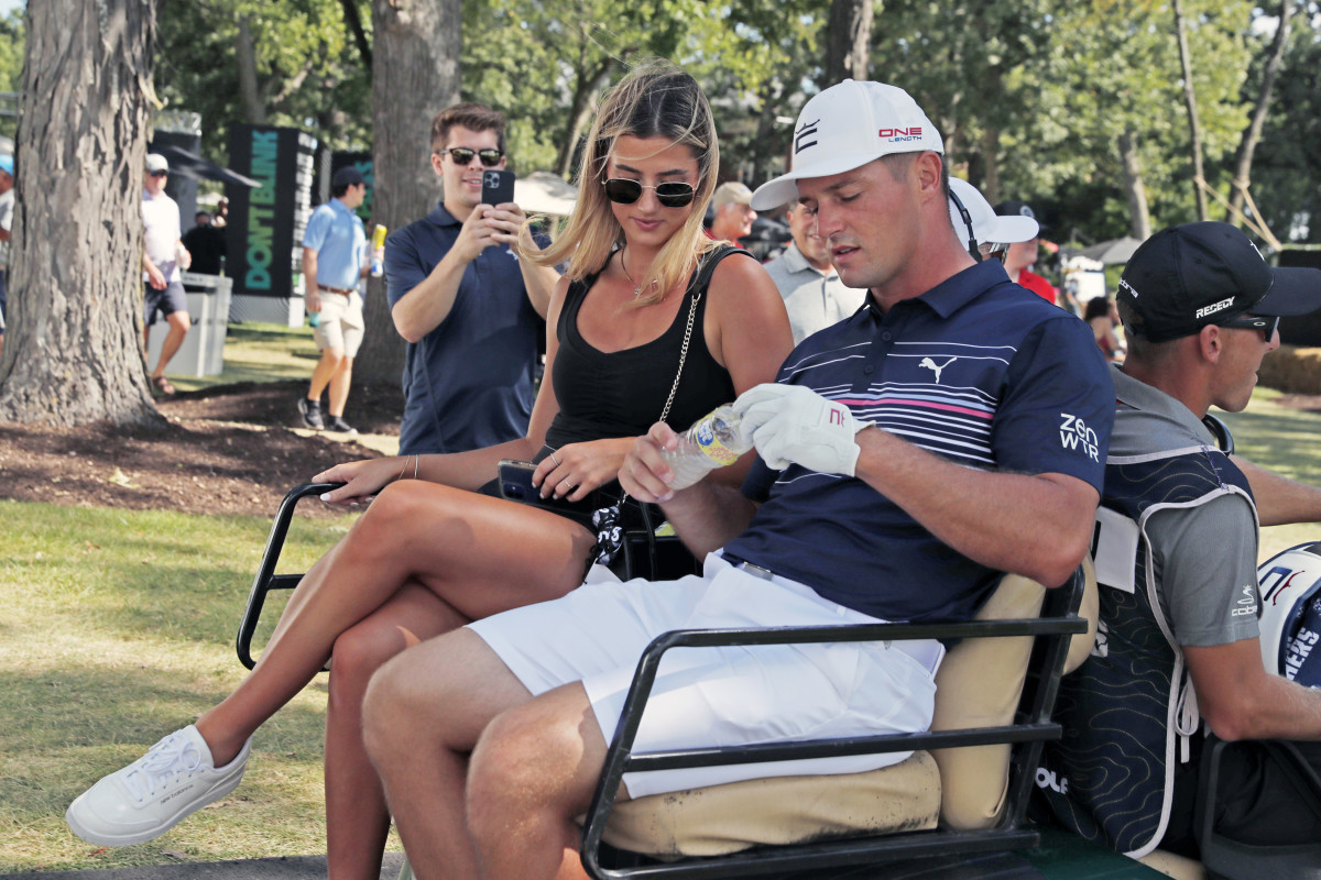 SUGAR GROVE, IL - SEPTEMBER 18: LIV golfer Bryson DeChambeau with his girlfriend Hunter Nugent leave in a golf cart for the shot gun start during the final round of the LIV Golf Invitational Series Chicago at Rich Harvest Farms in Sugar Grove, Illinois.  (Photo by Brian Spurlock/Icon Sportswire via Getty Images)