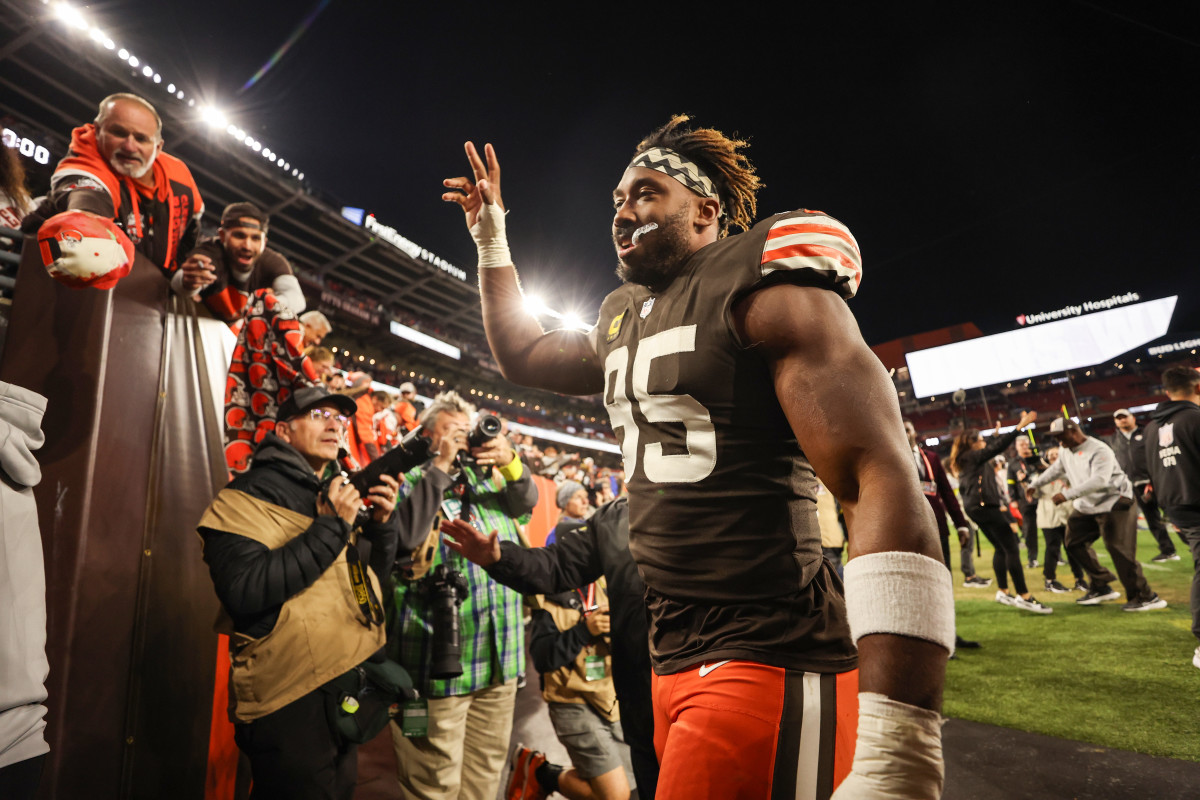 Myles Garrett waves to Browns fans while leaving the field in Cleveland.