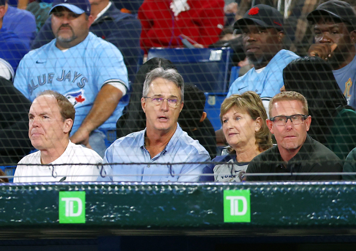 Roger Maris Jr. sits in the stands with Aaron Judge's mother.