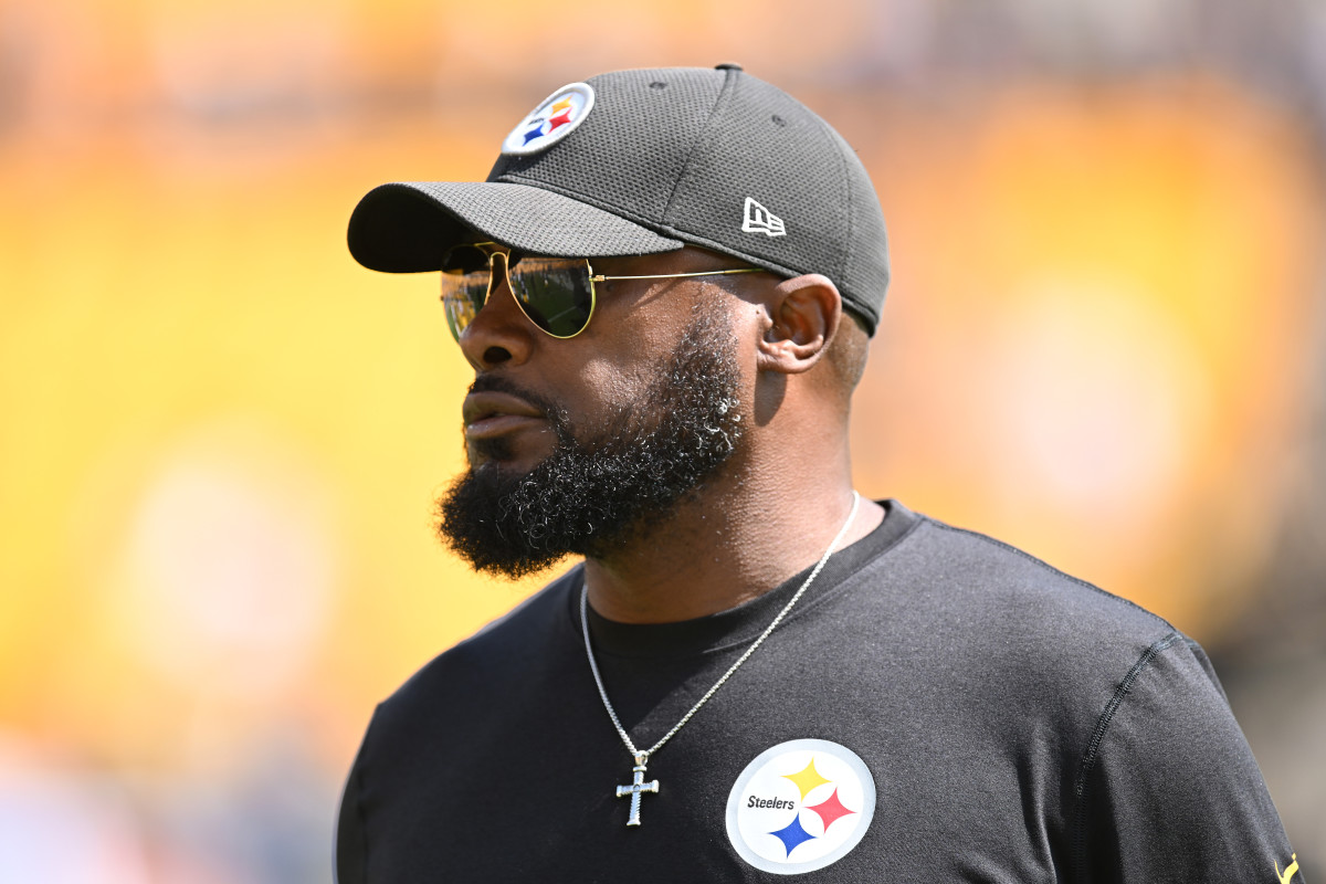 Steelers head coach Mike Tomlin watches warm ups before a game against the New England Patriots.