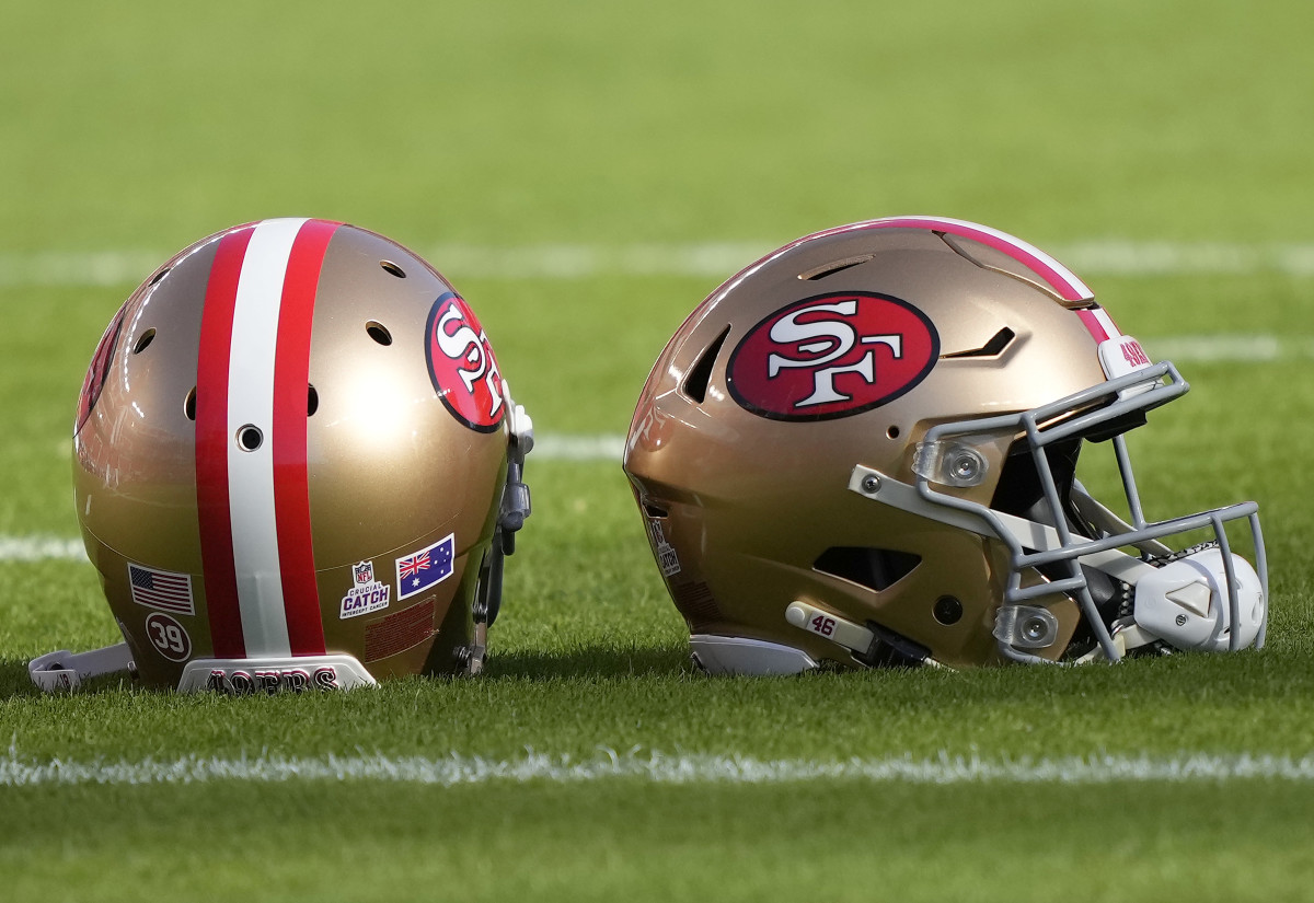 San Francisco 49ers helmets sitting on the field prior to the start of a game against the Rams at Levi's Stadium.