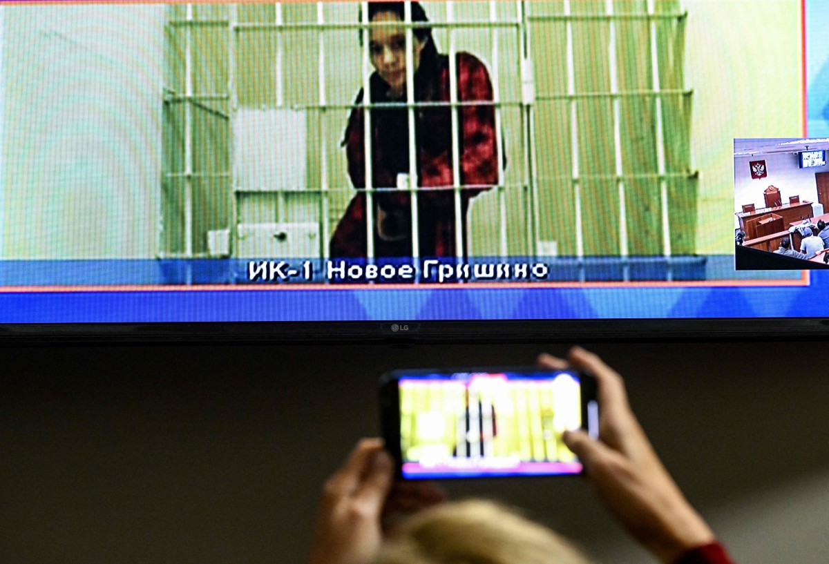 Brittney Griner at her prison hearing over video from Russia.